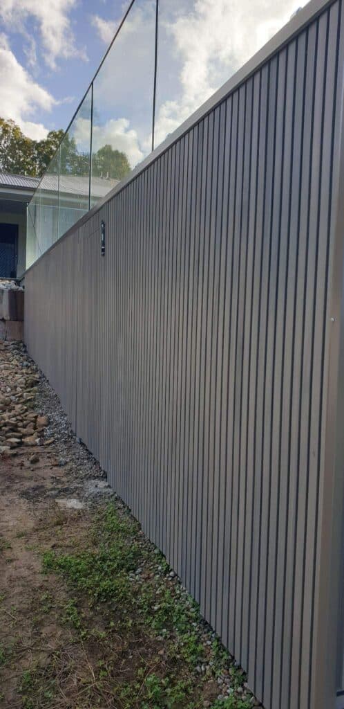 Castellated composite cladding installed on a modern home